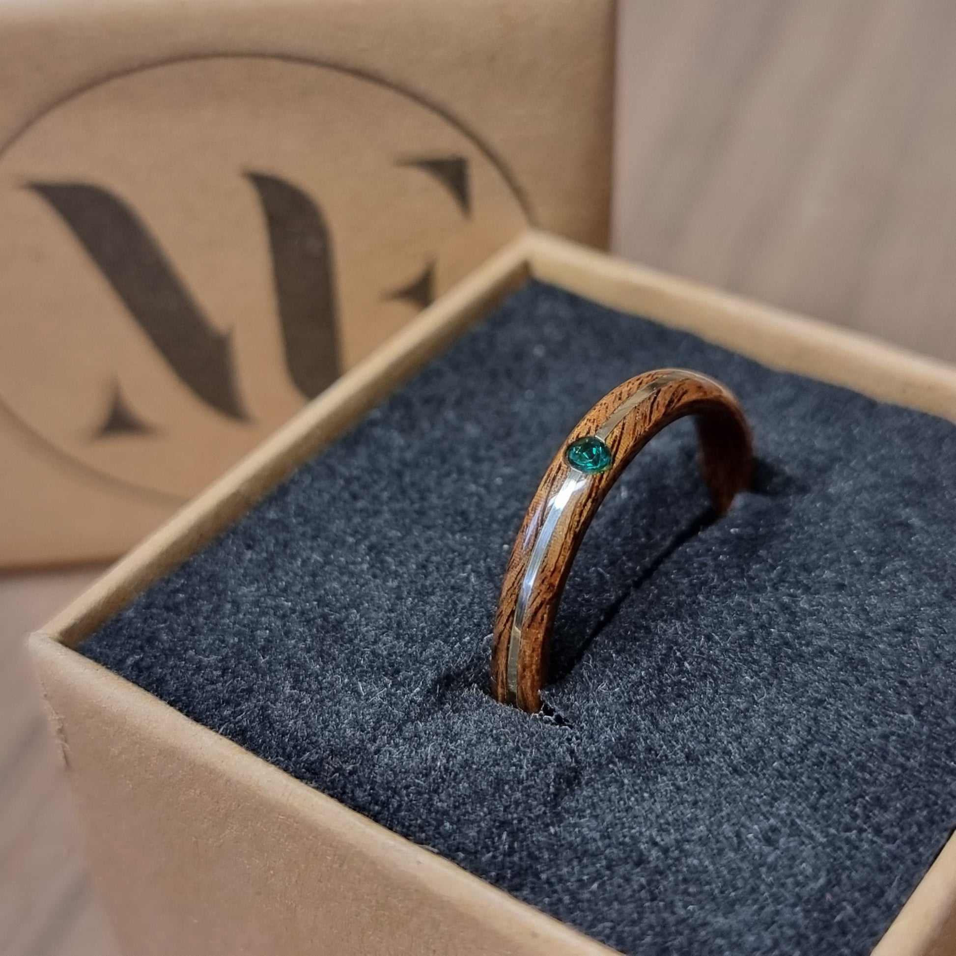 Rosewood and sterling silver with lab created emerald hand made bent wood ring