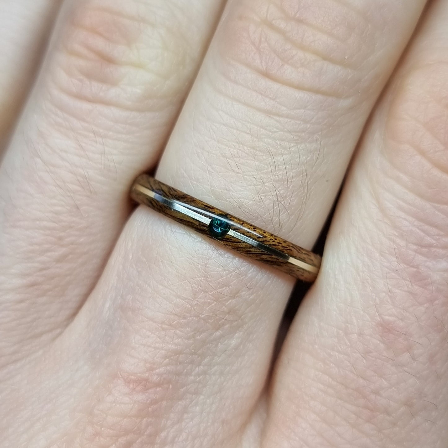 Rosewood and sterling silver with lab created emerald hand made bent wood ring