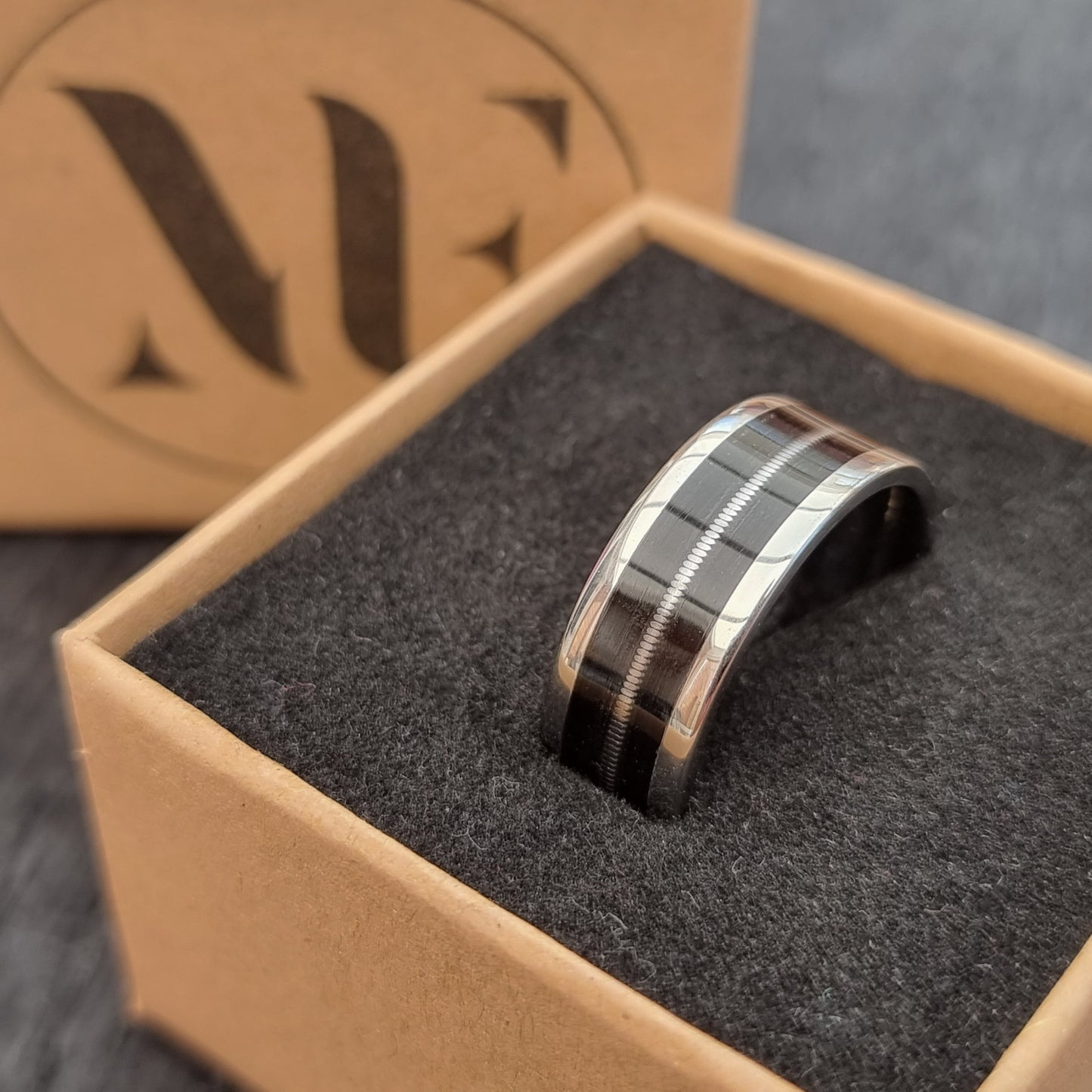 Stainless steel & black oak ring with guitar string