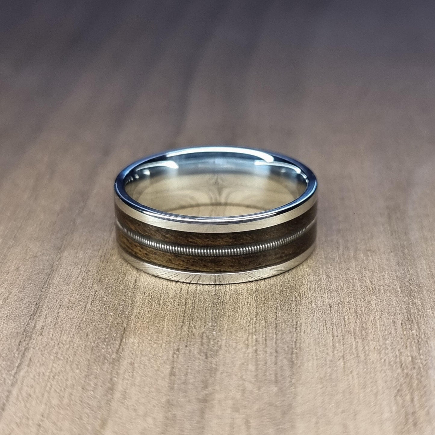Stainless steel and smoked eucalyptus with guitar string inlay ring