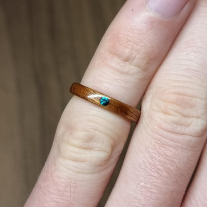 Sapele and lab emerald hand made bent wood ring