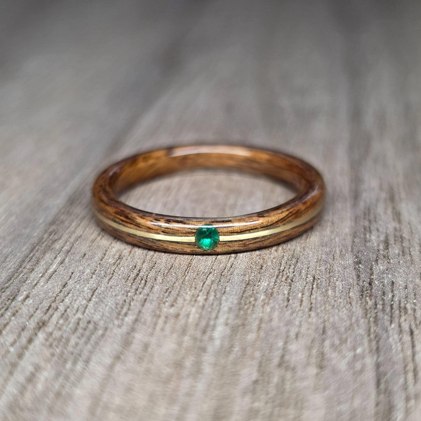 Rosewood and green tulipwood with brass and lab created emerald hand made bent wood ring
